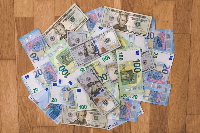 dollars and euros spread on a table